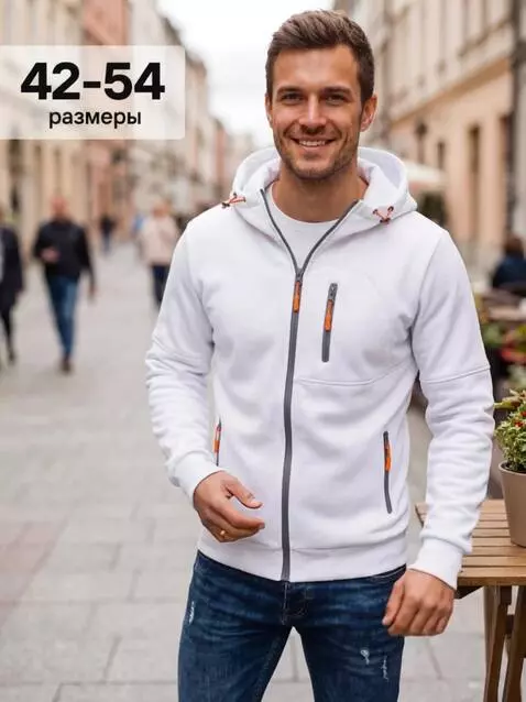 AI Video from prompt: A smiling young man standing on a cozy European 