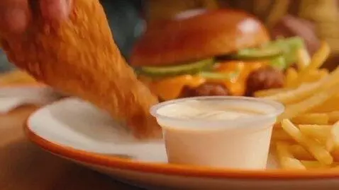 AI Video from prompt: The video starts with the chicken wing and vanil