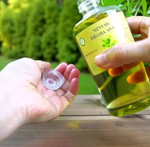 AI Video from prompt: A cinematic close-up shot of a Sidr oil bottle. 