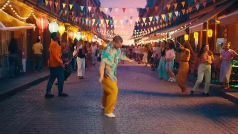 AI Video from prompt: make him in latex costume and dance