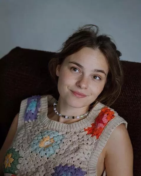 AI Video from prompt: the girl is looking straight at the camera. her 