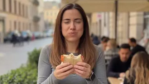 AI Video from prompt: eating food by woman