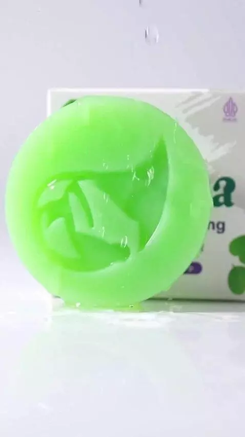 AI Video from prompt: A bar of herbal soap slowly zooms in from a dist