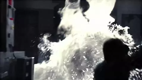 AI Video from prompt: Dark screen. Subtle film grain. A quiet, conspir