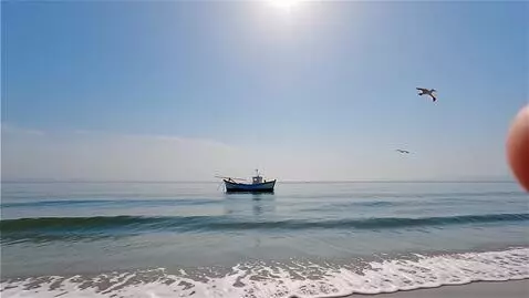 AI Video from prompt: Create a 30-second video: view of the calm sea d