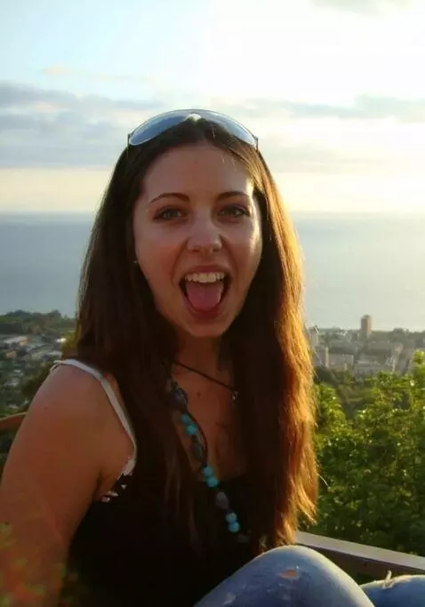 AI Video from prompt: The woman smiles shyly as she approaches the cam