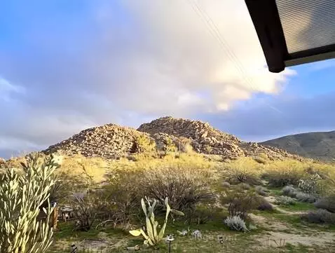 AI Video from prompt: the camera sweeps left revealing more of the sce