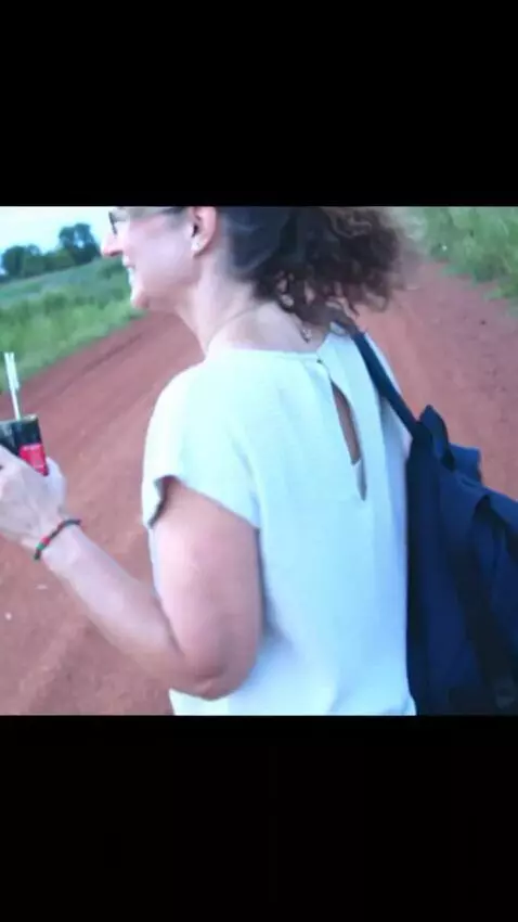 AI Video from prompt: The woman turns around and shows off her clothes