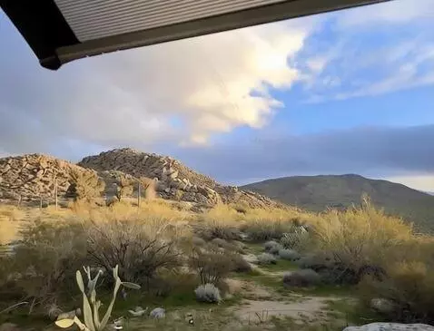 AI Video from prompt: the camera sweeps right revealing more of the sc