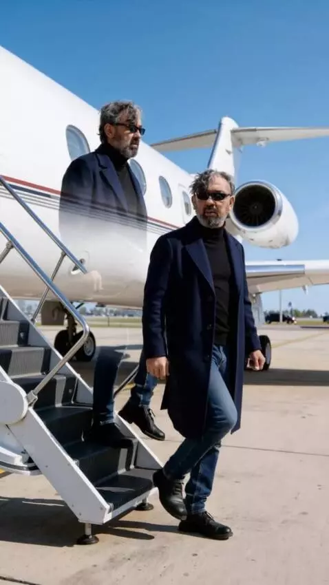 AI Video from prompt: A man with an exact replica of his face in the p