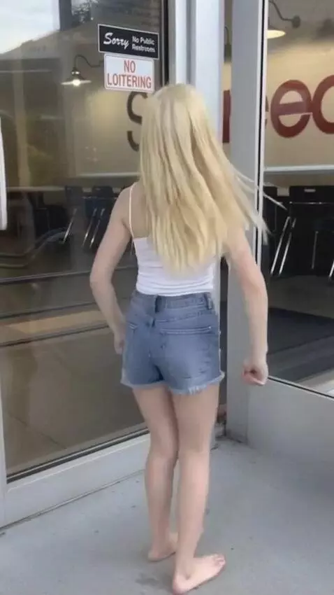 AI Video from prompt: Girl does a cute dance while it starts to downpo