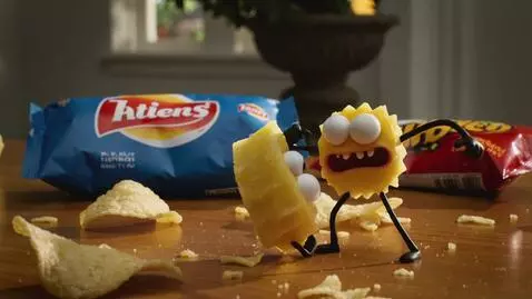 AI Video from prompt: A wooden table with a bag of Lay's and Pringles 