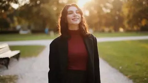 AI Video from prompt: a girl in fishnet tights shows her feet to the c