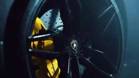 AI Video from prompt: Cinematic luxury car video of a glossy black Lam