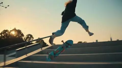 AI Video from prompt: A girl performs a jump on a skateboard, multi-ca