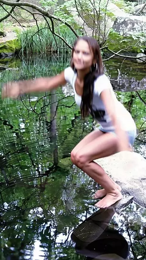 AI Video from prompt: a girl in a skirt jumps into the water