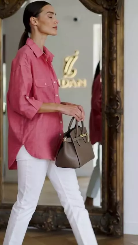 AI Video from prompt: Use the provided outfit as reference. Do not cha