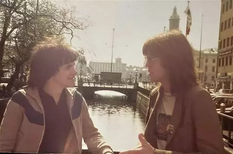 AI Video from prompt: the two English musicians chat together, they ha