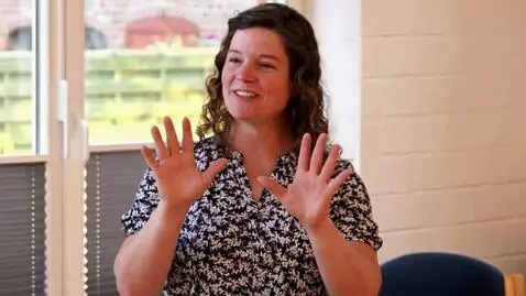 AI Video from prompt: she removes everything constricting her