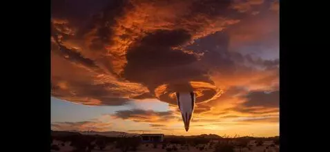 AI Video from prompt: the hole opens in the clouds and Ann immense wha