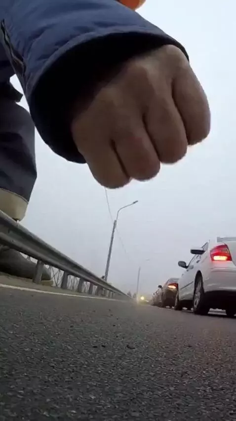 AI Video from prompt: A big man punches the ground, causing an earthqu