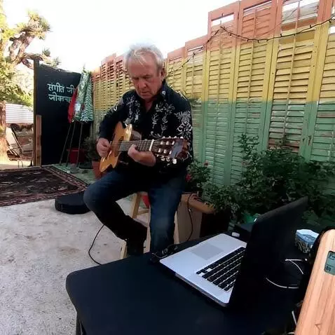 AI Video from prompt: the guitarist plays the music
