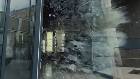 AI Video from prompt: These two budgies on tanks drive into a building