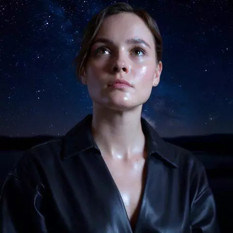 AI Video from prompt: the girl lifts her head and looks up. then she l
