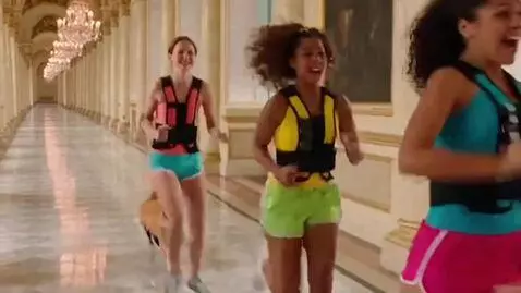 AI Video from prompt: Three young adult girls in bright athletic short