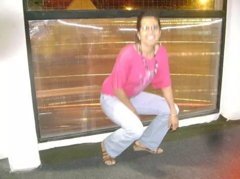 AI Video from prompt: The woman stands up and shows off her clothes