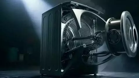 AI Video from prompt: Hyper-realistic washing machine transforming int