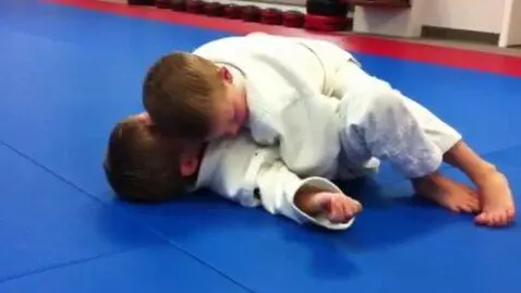 AI Video from prompt: two boys at six years,wearing white judo jackets
