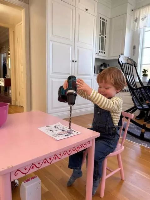 AI Video from prompt: He grabs a power drill. He positions the drill b