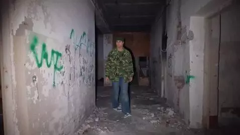 AI Video from prompt: The man in the photo lowers his hands and walks 