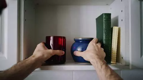 AI Video from prompt: Stack and arrange 3-5 items on a shelf or in the