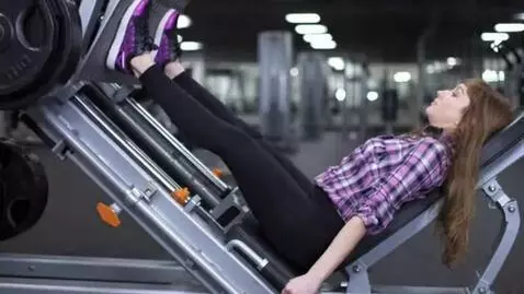 AI Video from prompt: A girl performs a leg press exercise