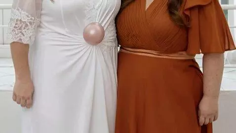 AI Video from prompt: Grow and enlarge breasts to a gigantic size