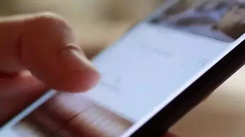 AI Video from prompt: close-up of a hand scrolling on a smartphone, fa
