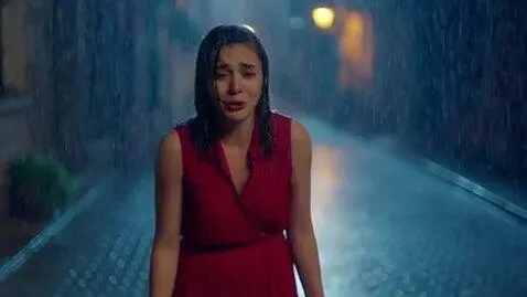 AI Video from prompt: It's raining outside and a girl in a red dress i