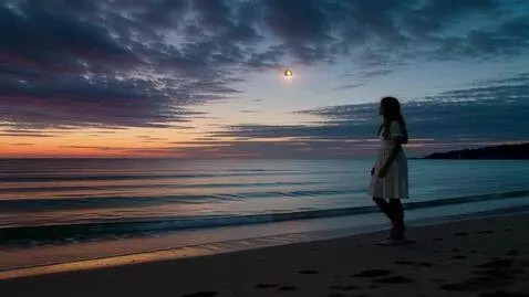 AI Video from prompt: A cinematic wide shot. Evening, calm sea. A girl