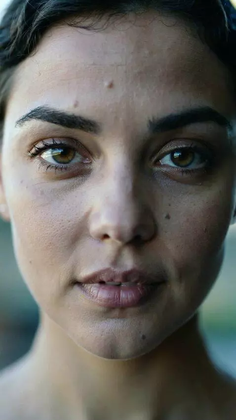 AI Video from prompt: Subtle animation of the woman's face, she blinks