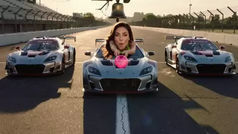 AI Video from prompt: A thrilling car racing scene unfolds on a sun-dr