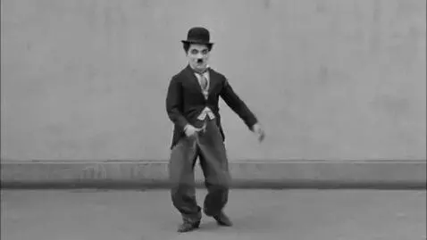 AI Video from prompt: Charlie Chaplin is dancing by himself.