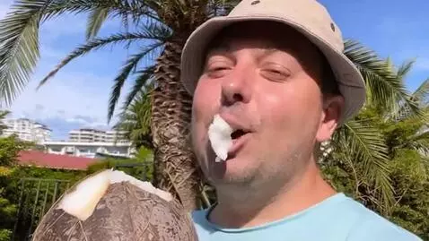 AI Video from prompt: The guy in the photo is taking a bite of a cocon