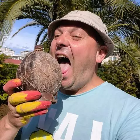 AI Video from prompt: The guy in the photo is taking a bite of a cocon