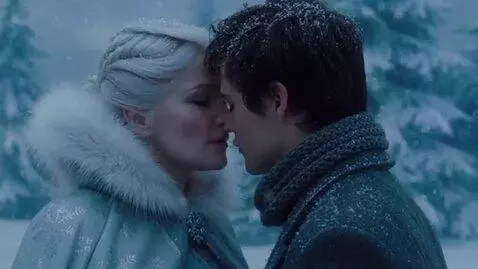 AI Video from prompt: A mature fifty-year-old snow queen kisses a youn