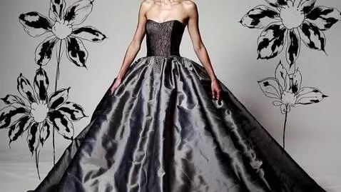 AI Video from prompt: model with black hair in a messy bun wearing a s