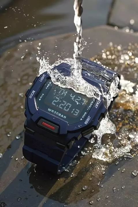 AI Video from prompt: The X-GEAR navy blue watch gets hit by splashing