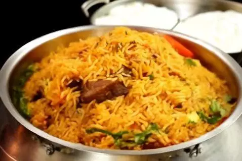 AI Video from prompt: Video of hyderabadi mutton dum biryani with basm