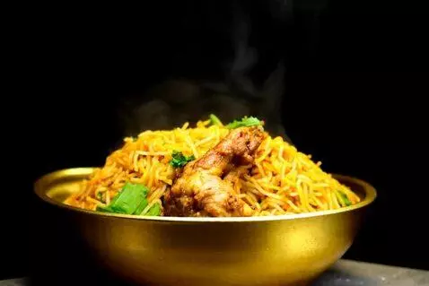 AI Video from prompt: Video of steaming hot hyderabadi chicken dum bir